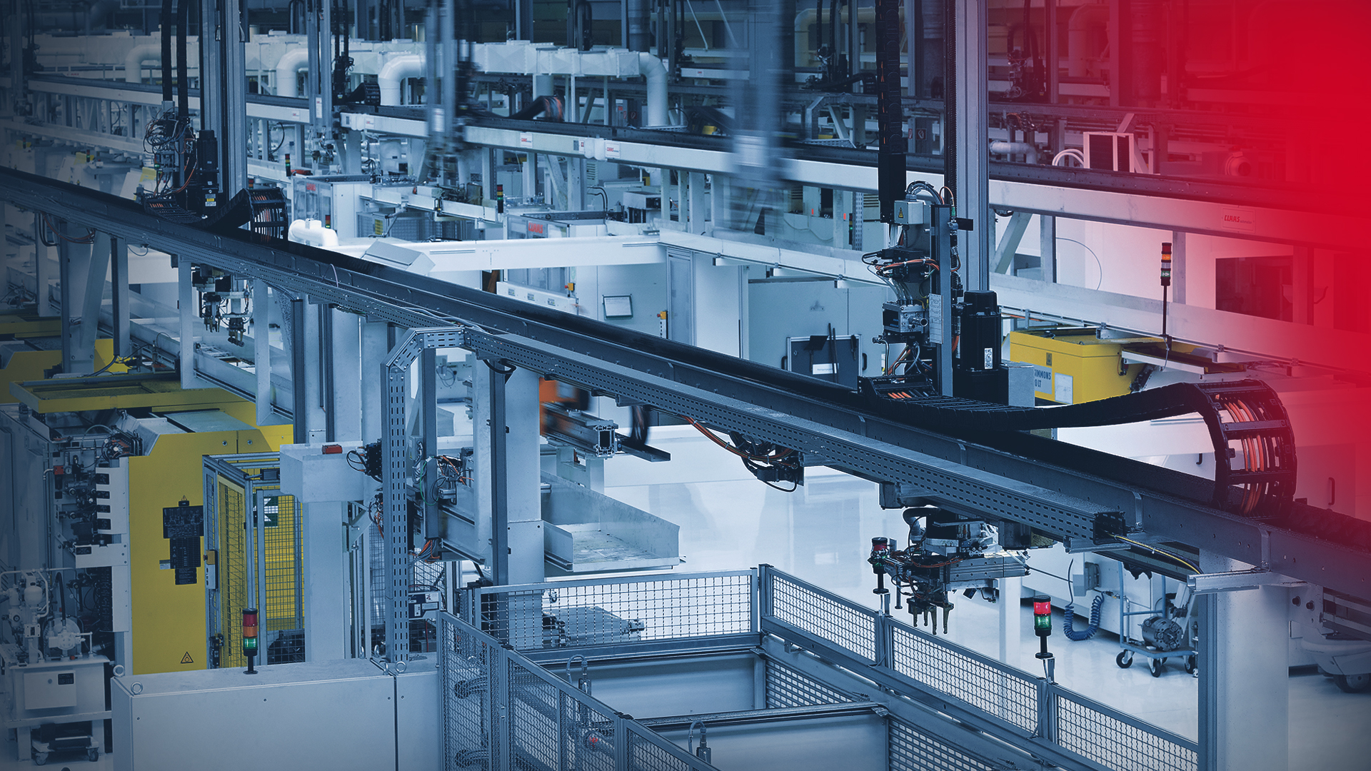 Factory hall with gantry robots supplying machining centers with material